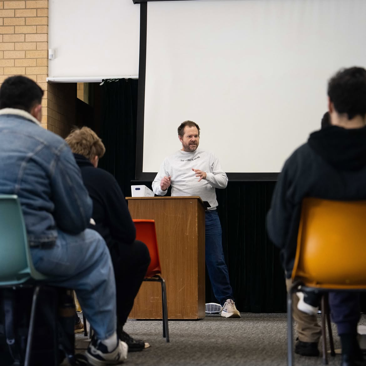 A CrüTech leader speaking to campers during a Bible talk